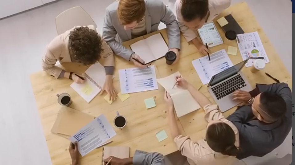 Team working at Rhotech office (click to play)